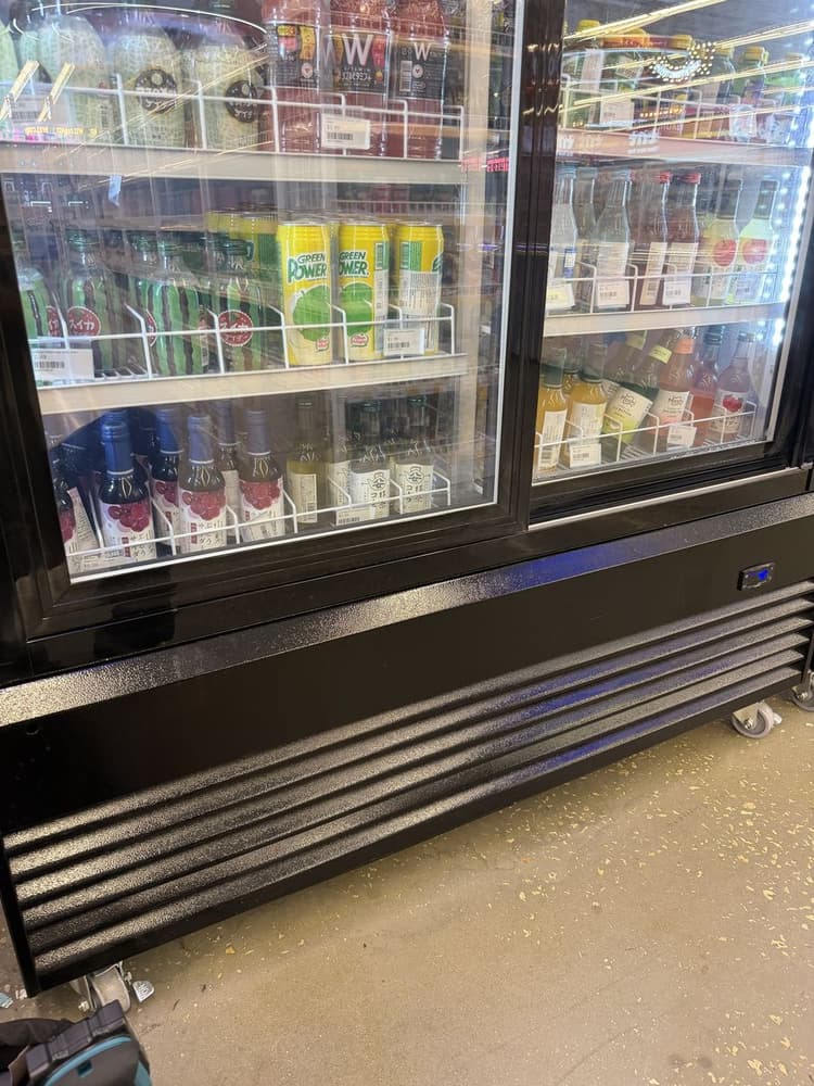 Glass-door beverage merchandiser at a Tampa Bay convenience store during a service call