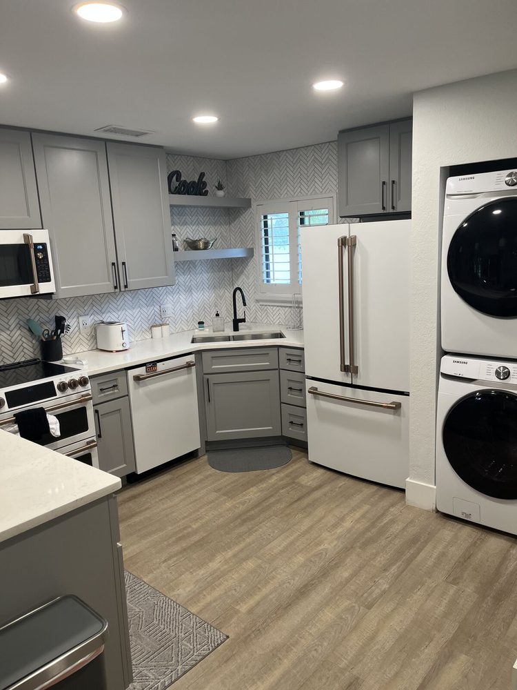 Kitchen with a built-in stacked washer and dryer column