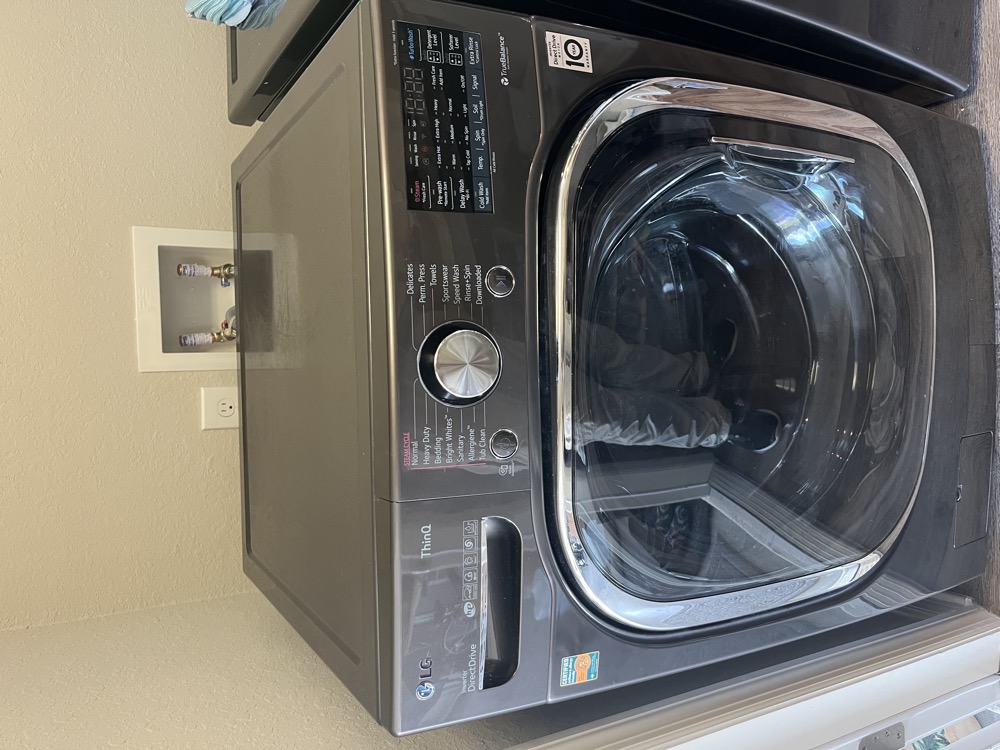 LG TwinWash front-load washer with SideKick pedestal in a Tampa Bay laundry room