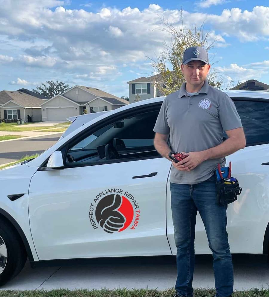 Anatoli 'Mark' Didenco, owner-technician, with the Perfect Appliance Repair Tampa service vehicle