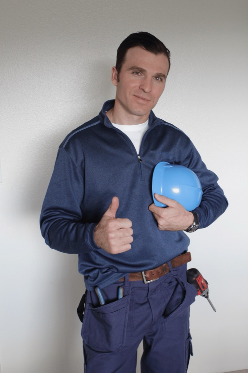 Appliance repair technician at work, Tampa Bay