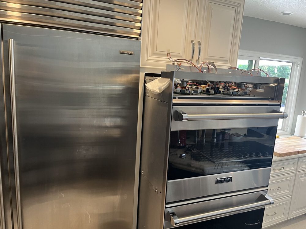Thermador rangetop with the control panel removed for access