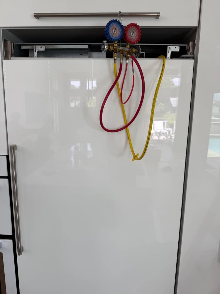 Manifold gauge set connected to a Viking built-in refrigerator during a sealed-system diagnosis on S Village Drive in Carrollwood