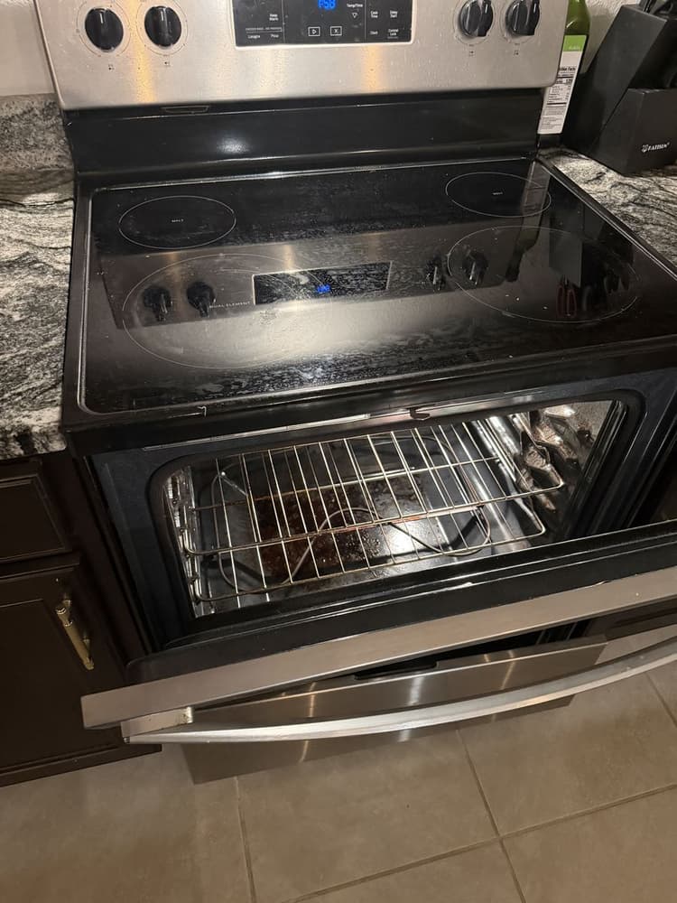 Whirlpool electric range pulled out for an oven repair on W Kennedy Blvd, Tampa, FL 33609