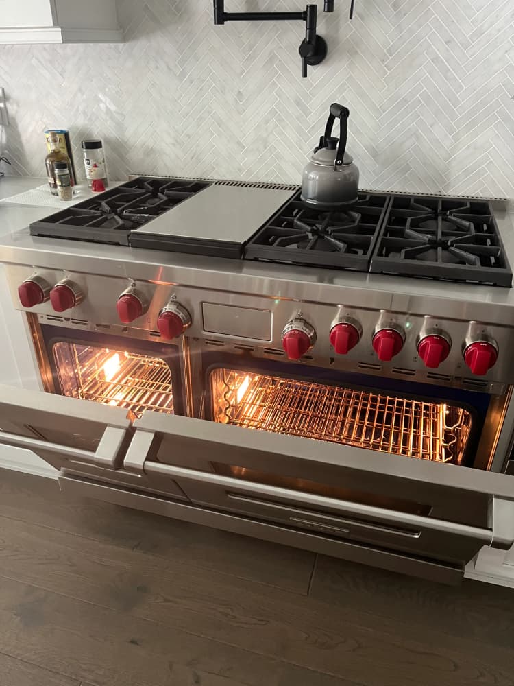 Wolf professional gas range with red knobs and center griddle back in service after repair on MacDill Ave, South Tampa, FL 33611